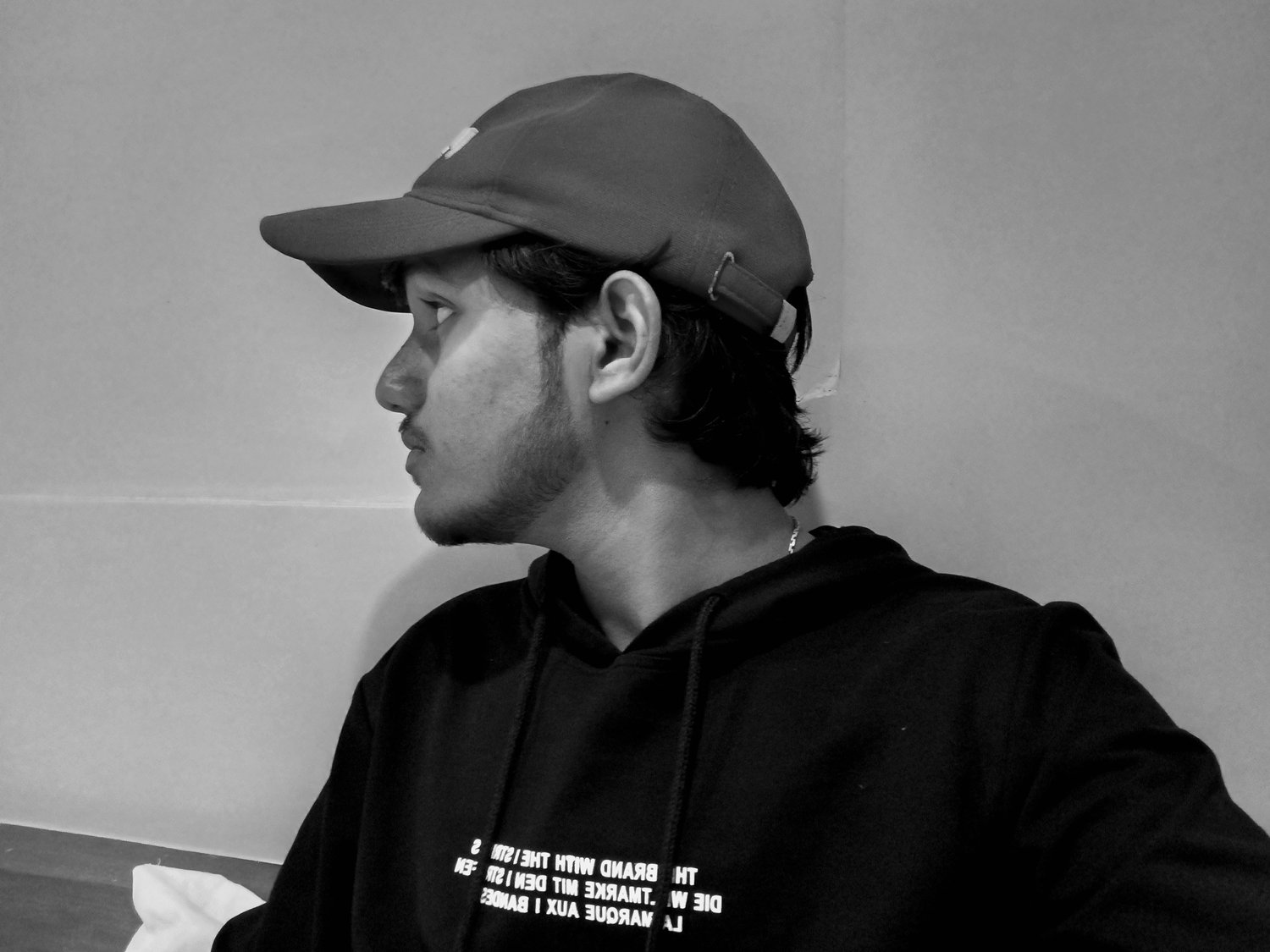 Profile with cap — monochrome side portrait
